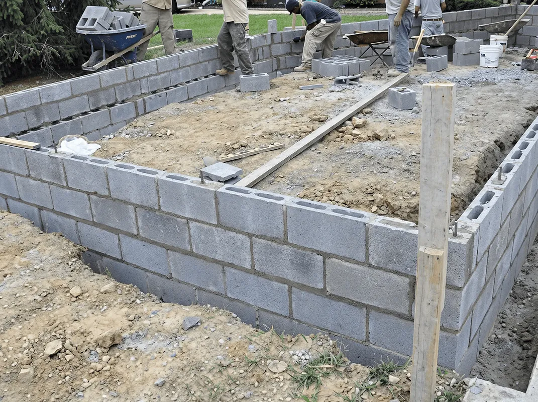 Professionals building a foundation with blocks in San Antonio, TX