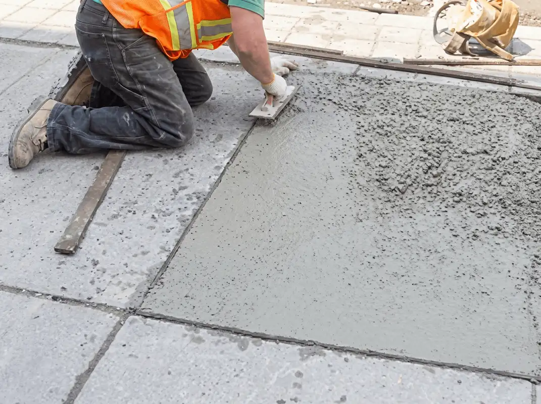 Professional repairing a concrete floor in San Antonio, TX